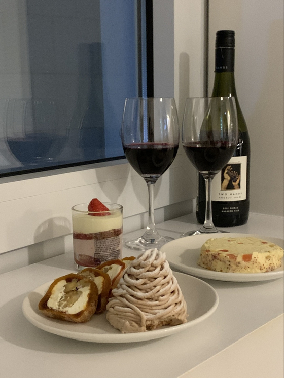 Homemade gotgam cheese walnut roll, left, among other desserts and wine [LEE JIAN]