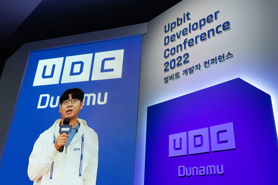 Dunamu Chairman Song Chi-hyung delivers an opening remark at the Upbit Developer Conference held at the Busan Port International Exhibition & Convention Center in Busan on Thursday. [DUNAMU]