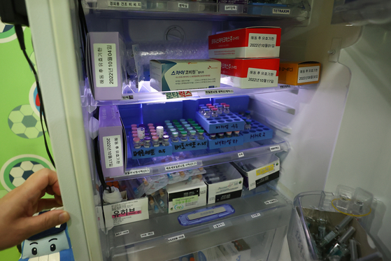 Vials of SKYCovione, developed by SK bioscience, are stored at a hospital in Seoul on Monday. Inoculations of Korea's first domestically developed Covid-19 vaccine began Monday for individuals who made online reservations, a week after reservations were made available on Sept. 19. [YONHAP]