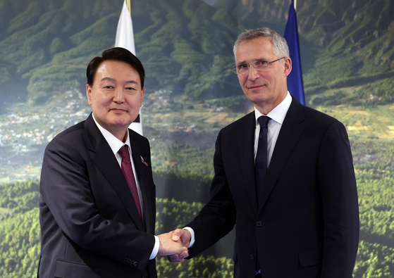 President Yoon Suk-yeol, left, meets NATO Secretary General Jens Stoltenberg on the sidelines of the NATO summit in Madrid last June 30. [JOINT PRESS CORPS] 