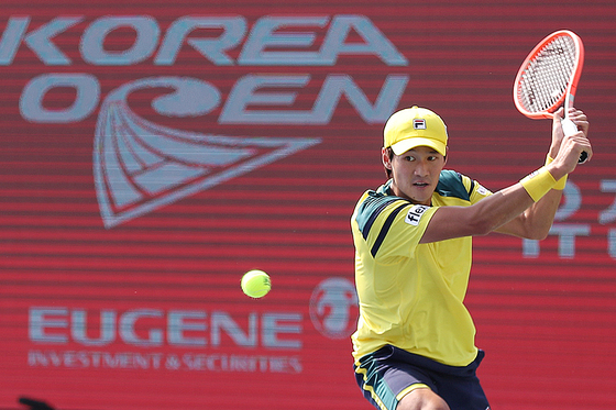 Kwon Soon-woo lunges for the ball during a round of 16 match against Jenson Brooksby on center court at the Korea Open at Olympic Park Tennis Center in southern Seoul on Thursday.  [NEWS1]