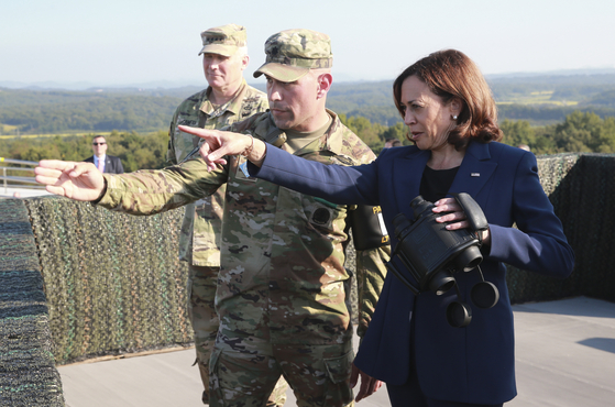 U.S. Vice President Kamala Harris, right, looks at North Korea from Observation Post Ouellette inside the demilitarized zone separating Korea at the western section of the inter-Korean border in Paju, Gyeonggi, on Thursday. [YONHAP]