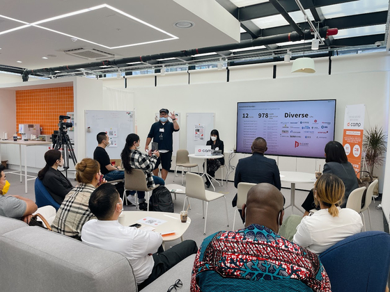 Participants in D.Camp's first Meet Korea program, a networking program for foreign entrepreneurs in Korea, listen to a session led by Eugene Kim, managing partner at start-up accelerator SparkLabs, on Thursday at D.Camp Startup Lounge in Busan. [D.CAMP]