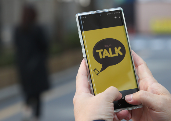 A user opens the KakaoTalk app on their phone. [YONHAP]