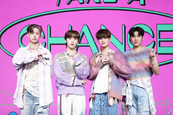 AB6IX poses during an online press showcase event for its latest EP ″Take a Chance,″ which dropped Tuesday. From left: Kim Dong hyun, Jeon Woong, Lee Dae hwi and Park Woo jin [BRANDNEW MUSIC]
