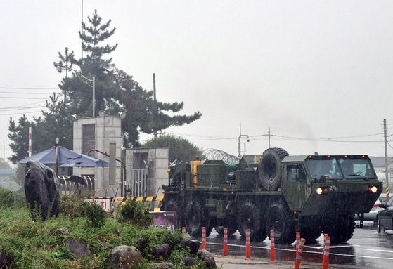 Military vehicles arrive Wednesday to clear up debris from the site where a Hyunmoo-2 missile crash landed the previous night. [NEWS1] 