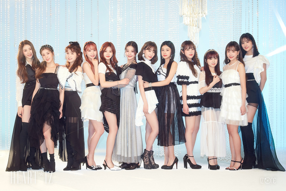 Lee, far left, was a member of project girl group IZ*ONE from 2018 to 2021. [SWING ENTERTAINMENT]