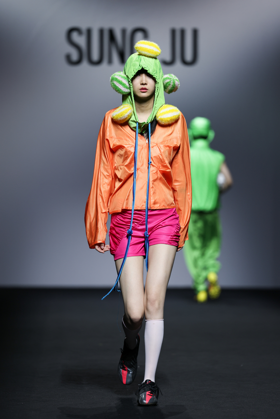 Sung Ju's collection emphasizes each garment’s solid colors of neon green or bright magenta. [SUNG JU]