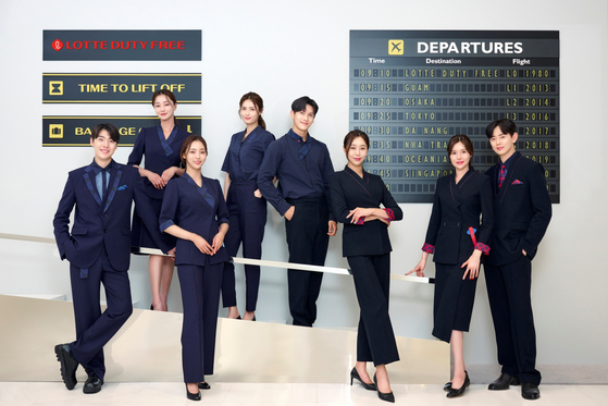 Employees wearing Lotte Duty Free's new hanbok-inspired uniforms. [LOTTE DUTY FREE]