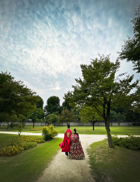 A couple dressed in hanbok stroll around Gyeongbokgung Palace. [ALLAND DHARMAWAN]