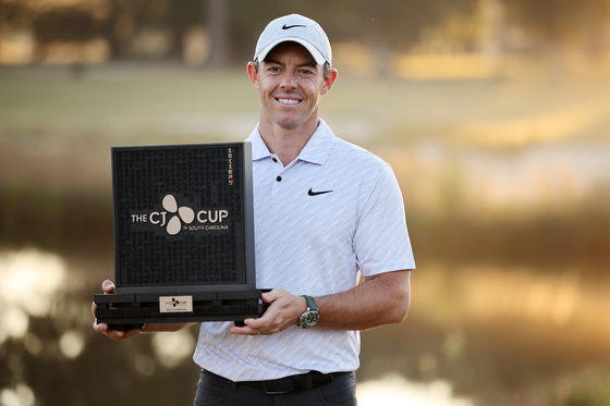 Rory McIlroy holds the CJ Cup trophy after the final round of the CJ Cup at Congaree Golf Club on Sunday in Ridgeland, South Carolina. [GETTY IMAGES FOR THE CJ CUP]