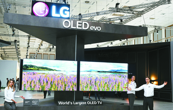 Models promote organic light-emitting diode (OLED) TVs made by LG Electronics at IFA 2022 in September. [NEWS1]