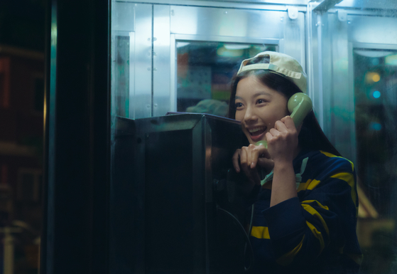 In the film, Kim’s character calls up her best friend’s crush in a phone booth to find out more about him. [NETFLIX]