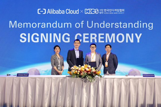 Executives from Alibaba Cloud and the Korea Indie Game Society (KIGS) pose for photos after signing an agreement to help Korean game developers launch their games in overseas markets. [ALIBABA CLOUD]