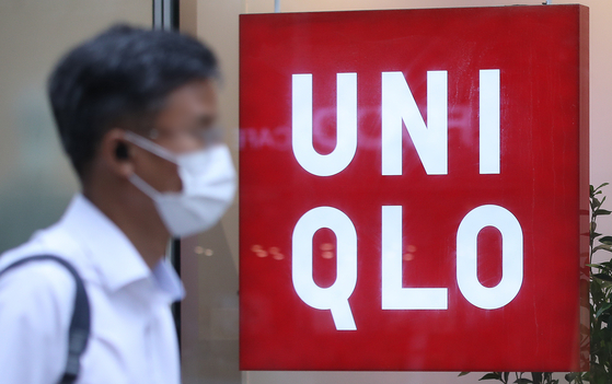A man walks by a Uniqlo store in Jongno District, central Seoul, on June 27. [NEWS1]