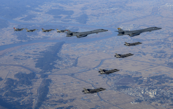 Two U.S. B-1B supersonic stealth bombers (upper right) are flanked by four U.S. F-16 fighters and four South Korea F-35A stealth fighters during the Vigilant Storm exercise on Saturday. [JOINT CHIEFS OF STAFF]