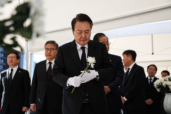President Yoon Suk-yeol pays respects at a mourning altar for victims of the Itaewon tragedy at Seoul Plaza, near City Hall, in central Seoul, on Saturday morning. [PRESIDENTIAL OFFICE]