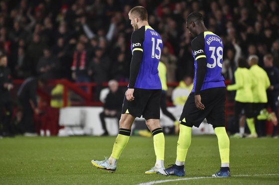 Tottenham's Eric Dier, center, and Yves Bissouma react after Nottingham Forest's Jesse Lingard scored his side's second goal during a Carabao Cup third round match at City Ground in Nottingham, England on Nov. 9. [AP/YONHAP]