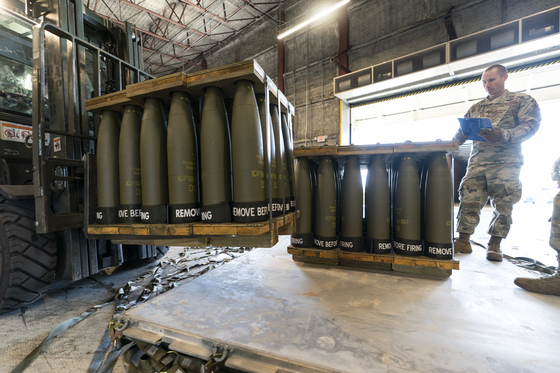 A U.S. Air Force Staff Sergeant inspects pallets of 155 mm shells at Dover Air Force Base, Delaware, on April 29, 2022. [AP]
