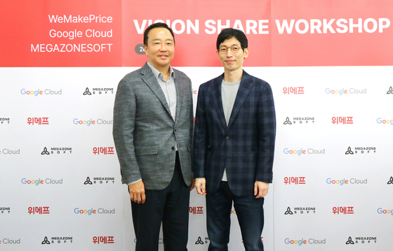Andrew Chang, managing director of Google Cloud Korea, left, and Ha Song, CEO of WeMakePrice, pose for a photo at the WeMakePrice headquarters in Gangnam District, western Seoul, on Friday. [GOOGLE CLOUD KOREA]