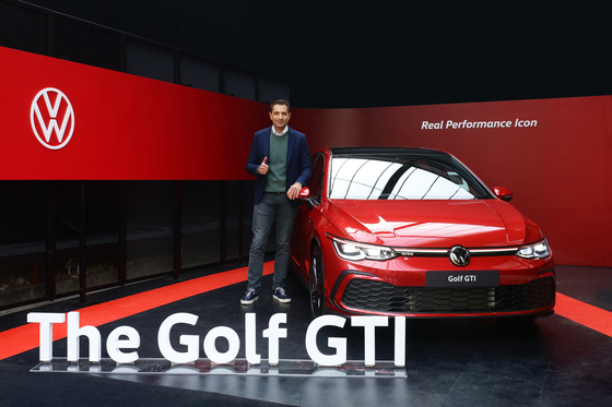 Sacha Askidjian, executive director of Volkswagen Korea, poses with the new Golf hatchback during a media event Wednesday held in eastern Seoul. [VOLKSWAGEN KOREA]