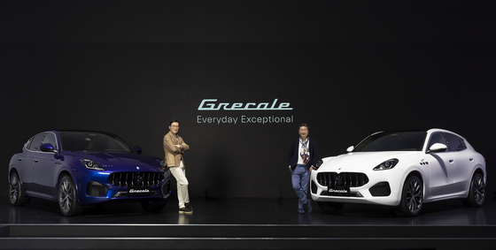 Kim Gwang-cheol, left, CEO of FMK, a Korean importer and distributor of Maserati cars and Takayuki Kimura, managing director of the Asia Pacific Region pose with the Grecale SUV Thursday during a press event held in Seocho District, southern Seoul. [MASERATI]
