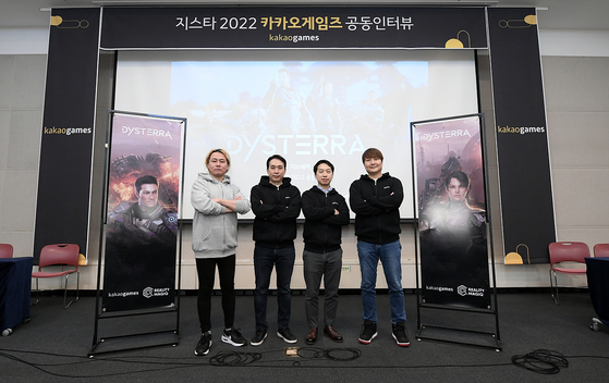 Developers of Dysterra stand for photo after an interview with the local press on Friday as a part of the G-Star 2022 game festival at Bexco, Busan. From left are: Choi Hyun-dong, lead game designer at Reality MagiQ; Kim Sung-kyun, CEO of Reality MagiQ; Jang Hak-joon, vice president of Reality MagiQ; and Lee Chang-yeol, head of the publishing business team at Kakao Games. [KAKAO GAMES]