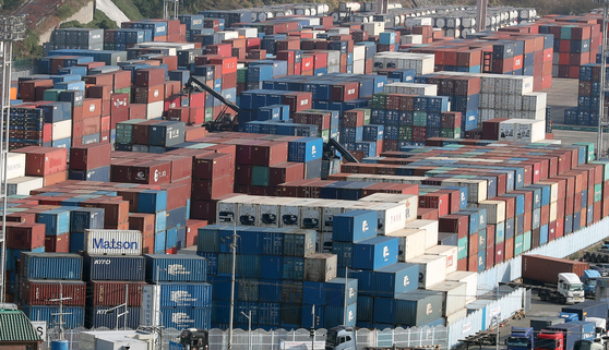 Containers are piled up at a port in Busan on Nov. 11, 2022. [YONHAP]