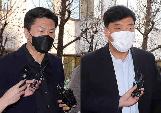 Former chief of the Yongsan Police Precinct Lee Im-jae, left, and Yongsan Fire Station Chief Choi Seong-beom, right, are seen walking into the office of the special investigation headquarters in Mapo District on Monday. [NEWS1]