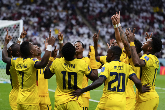Ecuador players celebrate after Enner Valencia scores their side's opening goal against Qatar during a match between Qatar and Ecuador at the 2022 World Cup at Al-Bayt Stadium in Qatar on Sunday.  [AP/YONHAP]
