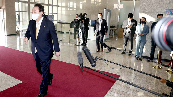 President Yoon Suk-yeol heads into the presidential office after speaking to reporters at the lobby of the presidential office in Seoul on Nov. 18. [PRESIDENTIAL OFFICE]