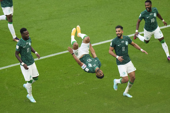 Saudi Arabia's Salem al-Dawsari, second from left, celebrates after scoring his side's second goal against Argentina on Tuesday.  [AP/YONHAP]