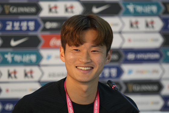 Kim Jin-su speaks during a press conference before a training session at Al Egla Training Site in Doha, Qatar on Tuesday. [AP/YONHAP]