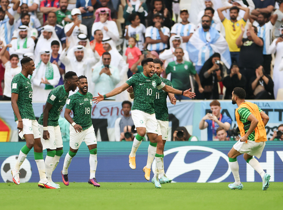 Salem al-Dawsari of Saudi Arabia celebrates with teammates after scoring during a Group C match against Argentina at the 2022 Qatar World Cup at Lusail Stadium in Lusail, Qatar on Tuesday.  [XINHUA/YONHAP]