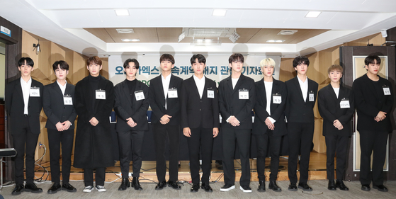 Members of Omega X attend a press conference at the Seoul Bar Association's Human Rights Room in southern Seoul on Nov. 16. [NEWS1]