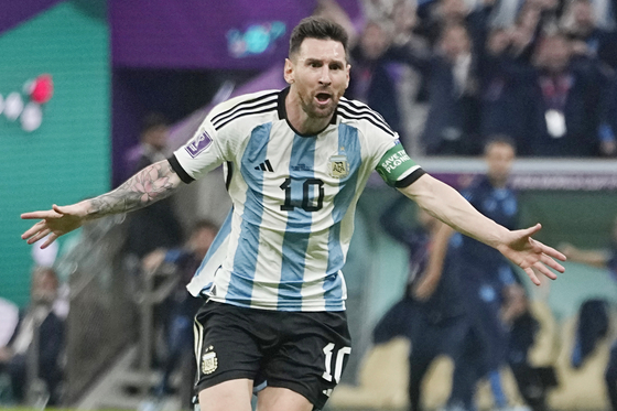 Argentina's Lionel Messi celebrates after scoring his side's opening goal during the World Cup group C match between Argentina and Mexico, at the Lusail Stadium in Lusail, Qatar on Saturday. [AP/YONHAP]