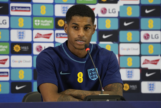 England's Marcus Rashford speaks to the media during a press conference at at Al Wakrah Sports Complex, in Al Wakrah, Qatar on Sunday. [AP/YONHAP]