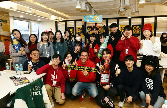 Students of the first OB Beer Marketing School pose during their last session on Nov. 26 [Oriental Brewery]