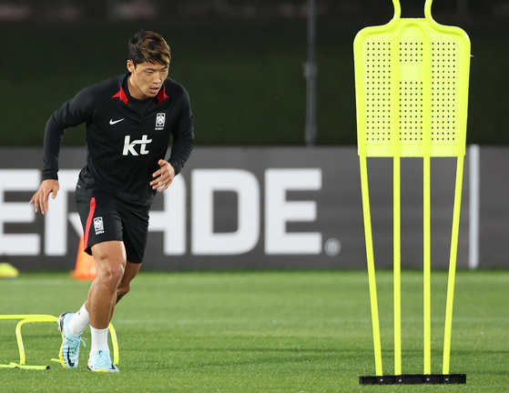 Hwang Hee-chan runs on the field at Al Egla Training Site in Doha, Qatar, on Wednesday. Despite returning to the field to train after skipping out on several days due to hamstring discomfort, Hwang was unable to play Korea's first two matches at the 2022 World Cup. [YONHAP]