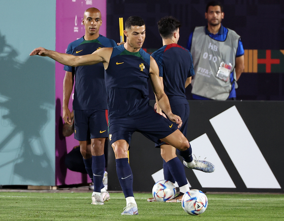 Cristiano Ronaldo shoots during a training session on Thursday at Al Shahaniya SC Training Facilities in Al-Shahaniya, Qatar ahead of Portugal's final group stage match against Korea scheduled Friday [REUTERS/YONHAP]