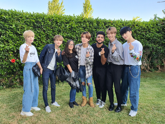 Oumaima Latrech, a 22-year-old student from Morocco, takes a photo with a K-pop boy band N.tic. [OUMAIMA LATRECH]