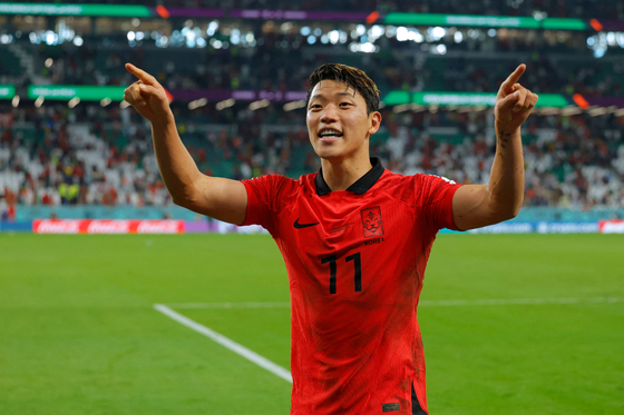 Hwang Hee-chan celebrates at the end of the Qatar 2022 World Cup Group H football match between Korea and Portugal at the Education City Stadium in Al-Rayyan, west of Doha on Friday. [AFP/YONHAP]