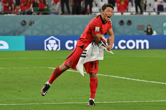 Hwang Hee-chan celebrates at the end of the Qatar 2022 World Cup Group H match between Korea and Portugal at the Education City Stadium in Al-Rayyan, west of Doha, on Friday. [AFP/YONHAP]