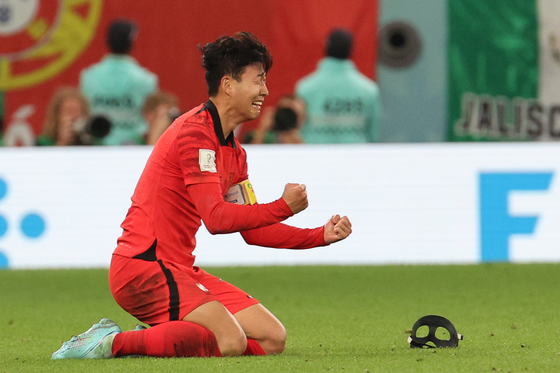 Son Heung-min reacts at the end of the match after beating Portugal 2-1 and qualifying for the knockout stages on Friday evening at the Education City Stadium in Al-Rayyan, west of Doha. [NEWS1]