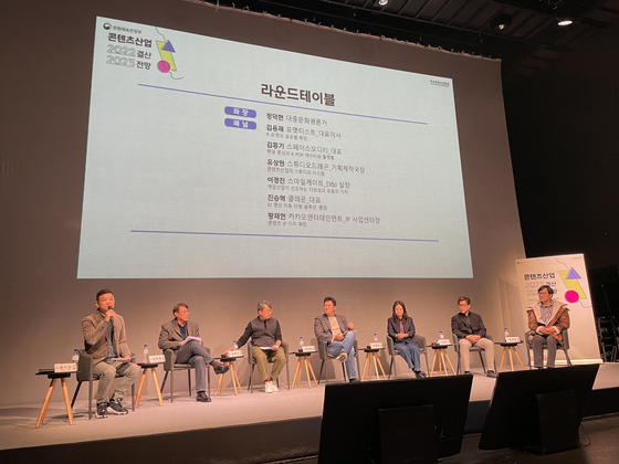 From left, culture critic Jeong Deok-hyun, FormatEast CEO Kim Yong-jae, Space Oddity CEO Beck Kim, Studio Dragon executive producer Yu Sang-won, Lee Kyung-jin, the head of the diversity and inclusion department of Smilegate, Klleon CEO Jin Seung-hyuk and Hwang Jae-heon, head of the IP Biz Center of Kakao Entertainment, participate as panels for a end-of-the-year seminar organized by the Korea Content Creative Agency in central Seoul on Wednesday. [LEE JAE-LIM]