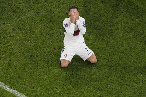 Portugal's Cristiano Ronaldo reacts after he failed to score during the World Cup quarterfinal match between Morocco and Portugal, at Al Thumama Stadium in Doha, Qatar on Saturday. [AP/YONHAP]