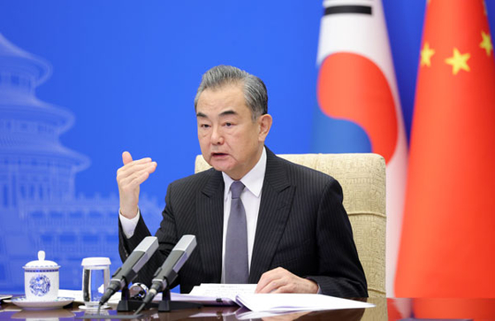 Chinese Foreign Minister Wang Yi speaks during his virtual meeting with Korean foreign minister in Beijing on Monday. [CHINESE MINISTRY OF FOREIGN AFFAIRS]