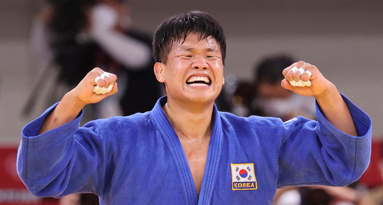 Judoka Cho Gu-ham celebrates after reaching the final at the 2020 Tokyo Olympics at Nippon Budokan in Tokyo on July 29, 2021.  [JOINT PRESS CORPS]