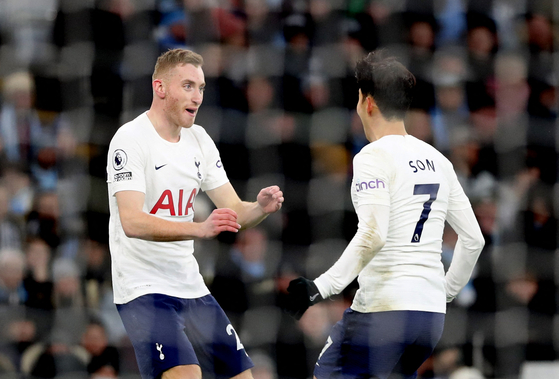 Tottenham Hotspur's Dejan Kulusevski celebrates with teammate Son Heung-min on Feb. 19.  [REUTERS/YONHAP]