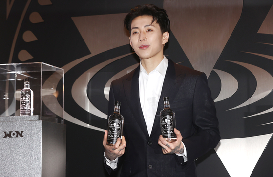 American rapper Jay Park poses for the photo holding up Won Soju at a pop-up store at The Hyundai Seoul in Yeongdeungpo District, western Seoul, on Feb. 25. Park is the CEO behind his company Won Spirits, which sells Won Soju and Won Soju Spirits. [YONHAP]